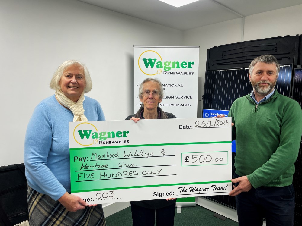 Manhood Wildlife and Heritage Group receiving a charity donation from Wagner Renewables Ltd