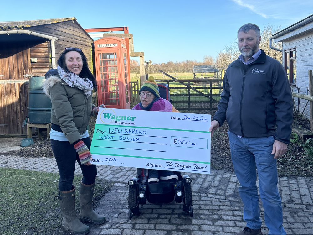 Wellspring West Sussex receive a cheque from Wagner Renewables towards their Wheely Wonders project